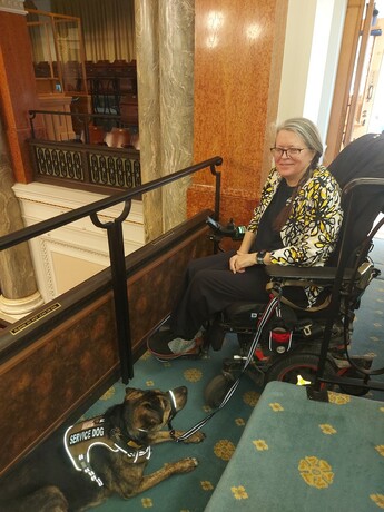 Michelle and Leo my service dog in the gallery of the BC legislature